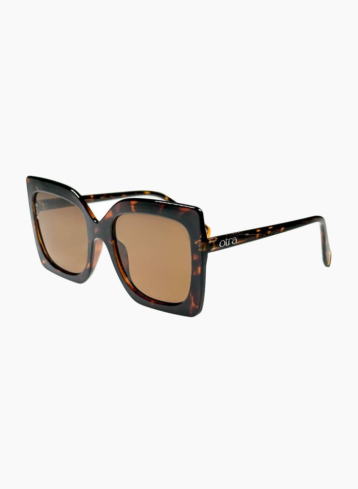 OVERSIZED SQUARED SUNGLASSES IN BROWN TORTOISESHELL The sophisticated Dynasty sunglasses have a strong editorial feel with their exaggerated sharp edges. A fashion statement in and of themselves, these sunglasses will make any outfit look more polished. PRODUCT DETAILS Frame Shape: Oversized Squared Frame Color: Tortoiseshell Lens Color: Brown, Lens Category 3 100% UV Protection Comes with a Protective Vegan Pouch SIZE MM INCHES FRAME WIDTH 145MM 5.7" FRAME HEIGHT 59.8MM 2.3" NOSE GAP 20MM 0.8" Chic Wayfarer Sunglasses For Vacation, Square Polarized Sunglasses For Vacation, Chic Sunglasses With Mirrored Lenses And Square Frame, Chic Square Framed Sunglasses With Mirrored Lenses, Chic Square Frame Sunglasses With Mirrored Lenses, Trendy Tortoiseshell Sunglasses With Mirrored Lenses, Modern Brown Sunglasses For Fall, Chic Tinted Sunglasses For Fall, Chic Tinted Lenses Sunglasses For Fall