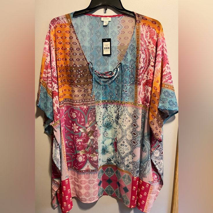 Vienna Beaded Kaftan - Pink Multi Color-Size 22/24 100% Polyester Key Features Include: - Lace-Up V-Neckline - Elbow-Length Poncho Sleeves - Pull-Over Fit - Embellished Detail - Relaxed Silhouette - Semi-Sheer Printed Fabrication - Curved Hemline At Hips Offers Welcome Multicolor Boho Print Tunic Top, Multicolor Tunic Blouse For Summer, Multicolor Blouse For Spring Beach Cover-up, Multicolor Spring Blouse For Beach, Pink Bohemian Relaxed Fit Blouse, Free Size Tunic Top For Vacation, Multicolor Tunic Top For Vacation, Printed Multicolor Tops For Beach Cover-up, Multicolor Printed Top For Beach Cover-up