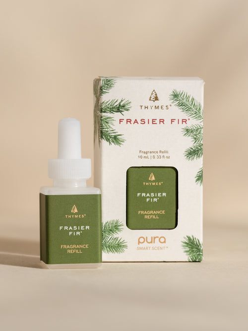 a bottle of frasier fir oil next to a box