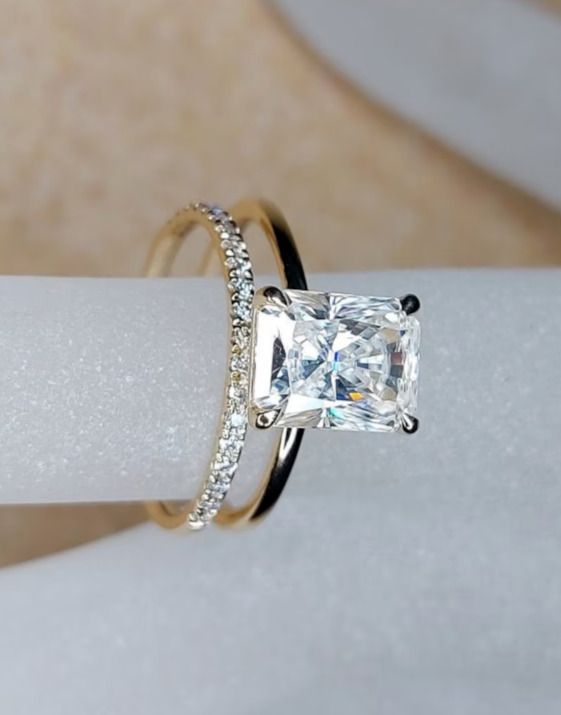 an engagement ring with a princess cut diamond