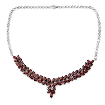 Alok Jain of India presents a garnet necklace that is truly worthy of royalty. He sets a stunning 25 carats of the faceted crimson stones in gleaming rhodium plated sterling silver and suspends the pendant from a classic silver rolo chain. The result is a breathtaking statement necklace.Rhodium plated .925 sterling silver Red Faceted Jewelry For Formal Occasions, Formal Ruby Jewelry With Faceted Details, Elegant Red Faceted Necklace, Formal Red Faceted Jewelry, Luxury Garnet Pendant Necklace, Round Garnet Gemstone Necklaces, Formal Red Faceted Necklace, Fine Jewelry Garnet Pendant, Fine Garnet Necklace As Gift