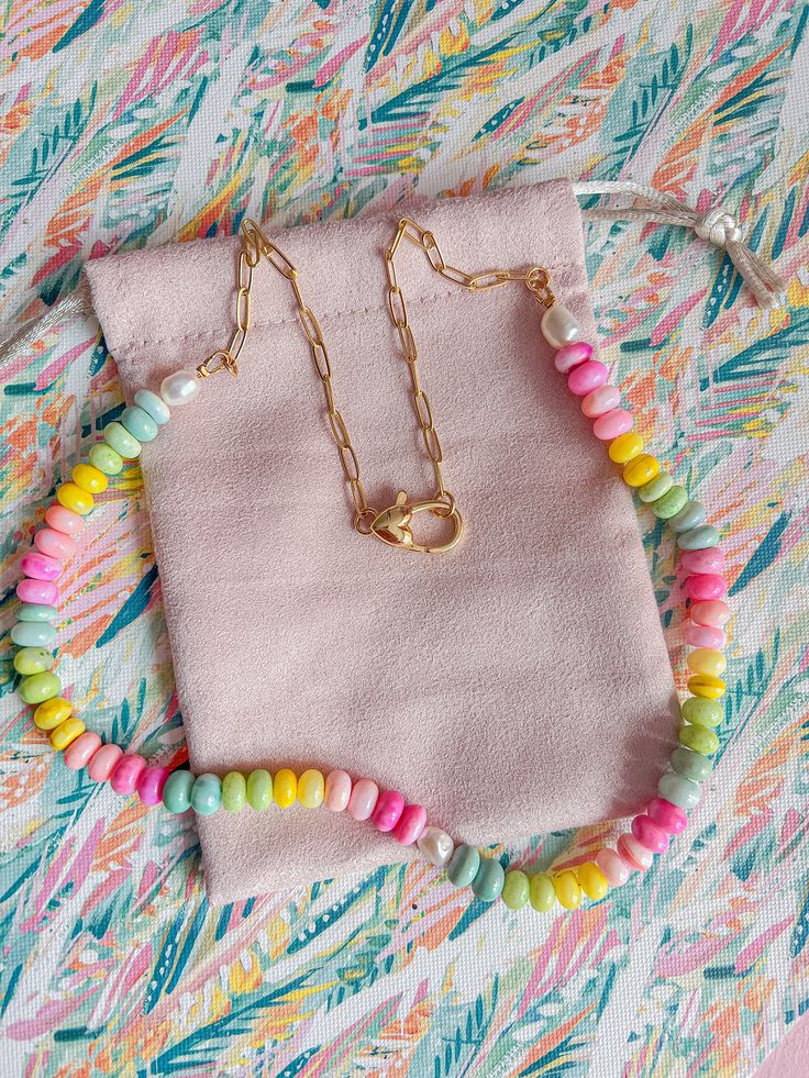 Indulge in some sweet summertime vibes with our Summer Candy Necklace. Handmade with colorful and bright beads, this necklace is the perfect accessory to add a touch of sunshine to any outfit. Plus, it's made with gold-filled materials for a bright and luxurious finish. Get ready to make a statement with this playful a Trendy Gold Beaded Necklaces With Lobster Clasp, Trendy Gold Beaded Necklace With Lobster Clasp, Handmade Colorful Necklaces For Vacation, Pink Necklaces With Colorful Beads For Vacation, Pink Necklace With Colorful Beads For Vacation, Gold Beaded Necklaces With Colorful Beads For Everyday, Everyday Multicolor Necklaces With Adjustable Chain, Everyday Multicolor Necklace With Adjustable Chain, Handmade Rainbow Necklaces For Everyday Wear