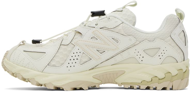 Low-top paneled waterproof GORE-TEX® mesh sneakers in tones of beige. · Textured rubber trim throughout · Cord-lock lace-up closure · Pull-loop at padded tongue and collar · Reflective logo appliqué at sides · Mesh lining · C-CAP foam rubber midsole · Treaded rubber sole Supplier color: Raw cashew/Pistachio butter/Turtledove Cream Mesh Sneakers With Perforations, New Balance Cream Running Shoes For Sports, Outdoor Cream Sneakers With Laces, Cream Sneakers With Laces For Outdoor, New Balance White Outdoor Sneakers, New Balance Outdoor Running Shoes, Outdoor New Balance Running Shoes, Functional Cream Sneakers For Outdoor, White New Balance Running Shoes For Outdoor