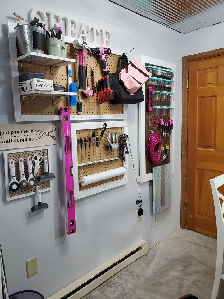 the wall is filled with many different items and tools, including hairbrushes, scissors, etc