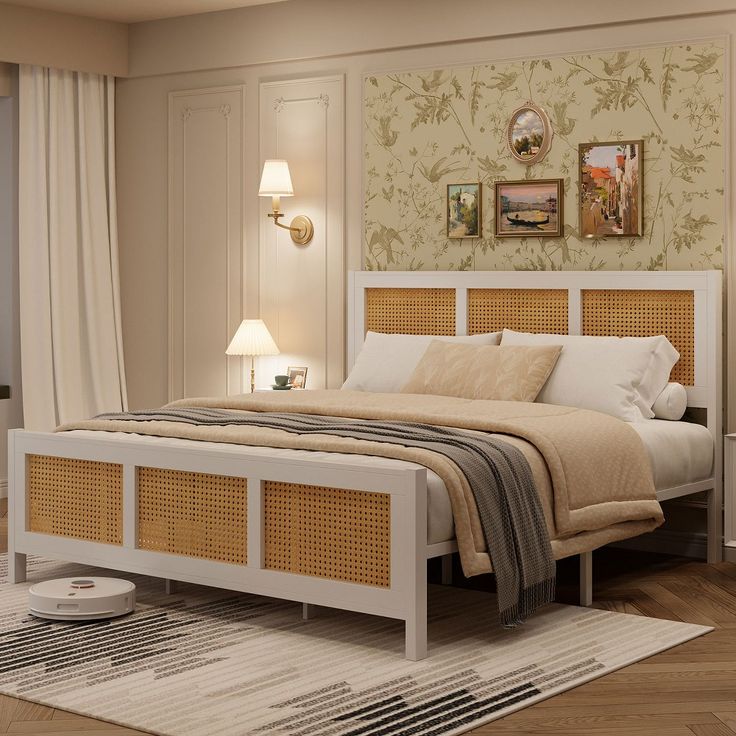 a white bed with wicker headboard and foot board next to a window in a bedroom