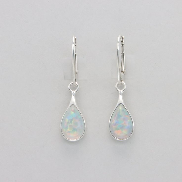 These is a pair of beautiful Earrings with lab created Fire Opal.  The earrings are made out of solid 925 Silver and there is no nickel or other substances causing most allergies. This makes the earrings hypo allergenic. Size of one Earring in total  3.5 x 0.9 cm / 1.38 x 0.35 inch The hooks are 1.8 cm or about 3/4 inch long. You will receive the item in a gift box - perfect to surprise someone or yourself. Usually we ship on the same day we receive the payment for the order. We want you to be h Sterling Silver Teardrop Earrings With Lever Back For Gifts, Gift Sterling Silver Teardrop Earrings With Lever Back, Classic White Teardrop Sterling Silver Earrings, Classic White Sterling Silver Teardrop Earrings, Sterling Silver Teardrop Earrings With Lever Back, White Sterling Silver Teardrop Earrings For Anniversary, White Gold Sterling Silver Teardrop Earrings, Hypoallergenic Sterling Silver Teardrop Earrings For Anniversary, White Sterling Silver Teardrop Pendant Earrings