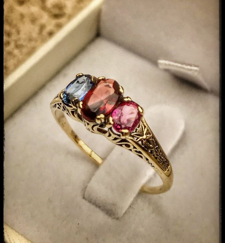 "Very unique handmade gold ring with real gemstones . 14k gold antique victorian ring with a real garnet stones in the middle + 1 real beautiful ruby in the side + one real beautiful sapphire on the other side . Hand made by myself Weight : about 1.9 gram Central stone : garnet 4/6 m\"m Ruby stone : 3/5 mm Sapphire stone : 3/5 mm" Elegant Three-stone Birthstone Ring In 14k Gold, Elegant Three Stone Birthstone Ring In 14k Gold, Elegant Gold Three-stone Birthstone Ring, Elegant Gold Three Stone Birthstone Ring, Elegant Three Stone Yellow Gold Sapphire Ring, Elegant Three Stone Sapphire Ring In Yellow Gold, Unique Yellow Gold Sapphire Ring With Rose Cut Diamonds, Vintage Oval Multi-stone Sapphire Ring, Vintage Multi-stone Oval Sapphire Ring