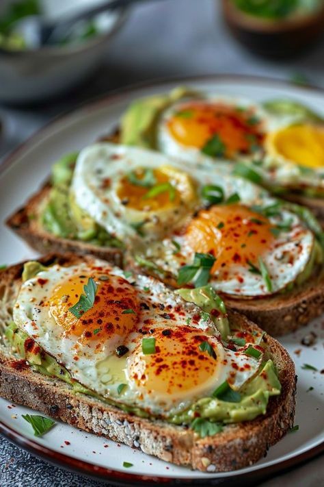 an egg and avocado toast on a plate