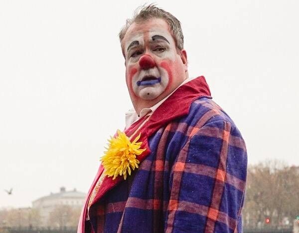 a man with clown makeup on his face