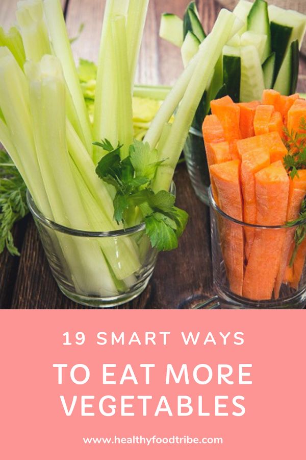 carrots and celery in glass cups with text overlay that reads 19 smart ways to eat more vegetables