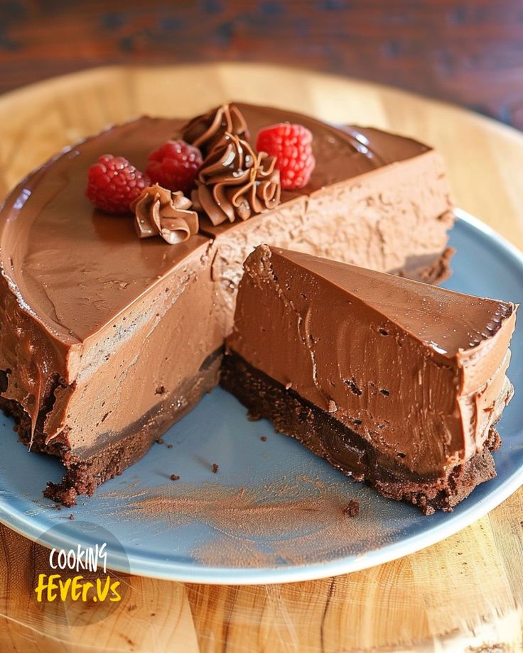 a chocolate cake with raspberries on top