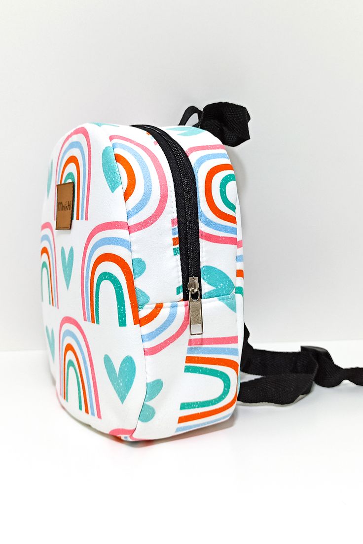 Rainbow blue heart pattern organic cotton mini backpack is designed for preshool kids and made of 100% cotton. The backpacks have an internal volume of 23X18 cm in which children can easily fit their toys, notebooks or anything they would like to take with them to school. Playful Bags For Back To School Gift, Cute Rainbow School Bag, Cute Rainbow School Bags, Playful Bag Gift For Back To School, Cute Multicolor Rectangular Backpack, Multicolor Standard Backpack For Playtime, Playful Multicolor Bags For Personal Use, Playful Rainbow School Bag, Back To School Gift Bags With Zipper Closure