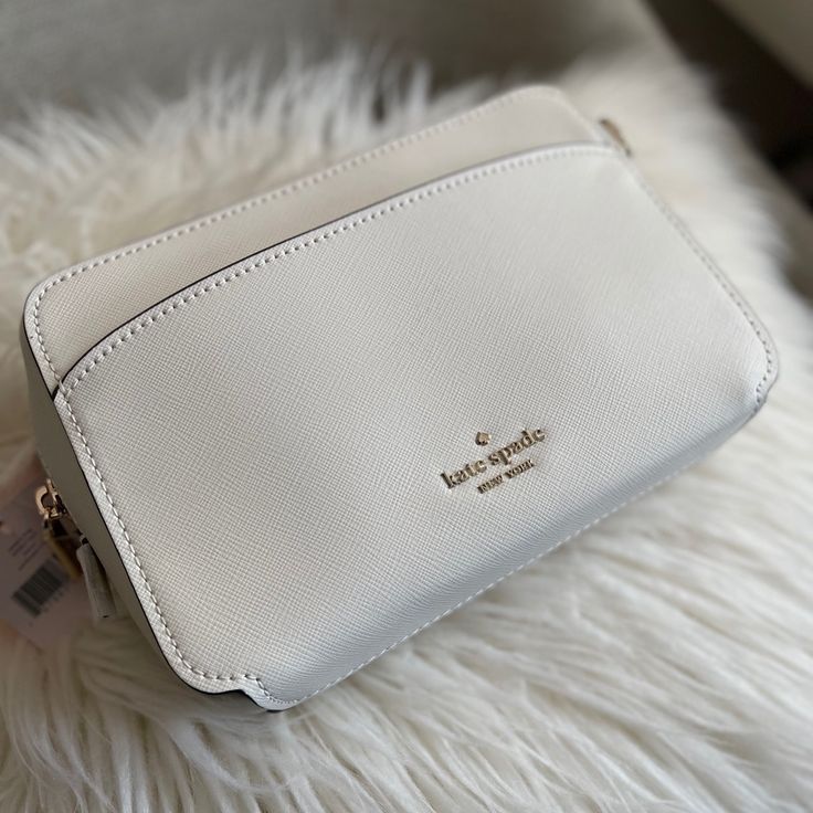 Brand New 5.75"H X 8.5"W X 2.5"D Saffiano Two Way Spade Jacquard Lining Exterior Front And Back Slip Pockets Crossbody With Zip Closure Style # Wkru7064 Color: Parchment Classic White Saffiano Leather Shoulder Bag, Kate Spade Saffiano Leather Evening Bag, White Saffiano Leather Travel Bag, Luxury White Saffiano Leather Shoulder Bag, Elegant Saffiano Leather Bags With Interior Card Slots, White Saffiano Leather Bag For Everyday Use, Elegant Crossbody Shoulder Bag With Interior Card Slots, White Saffiano Leather Rectangular Bag, White Saffiano Leather Bags