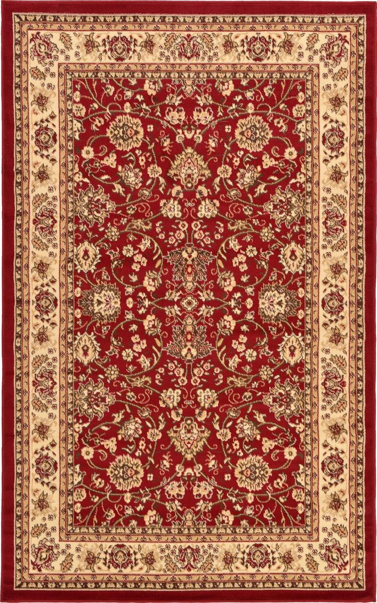 a red and beige rug with an ornate design on the center, surrounded by flowers