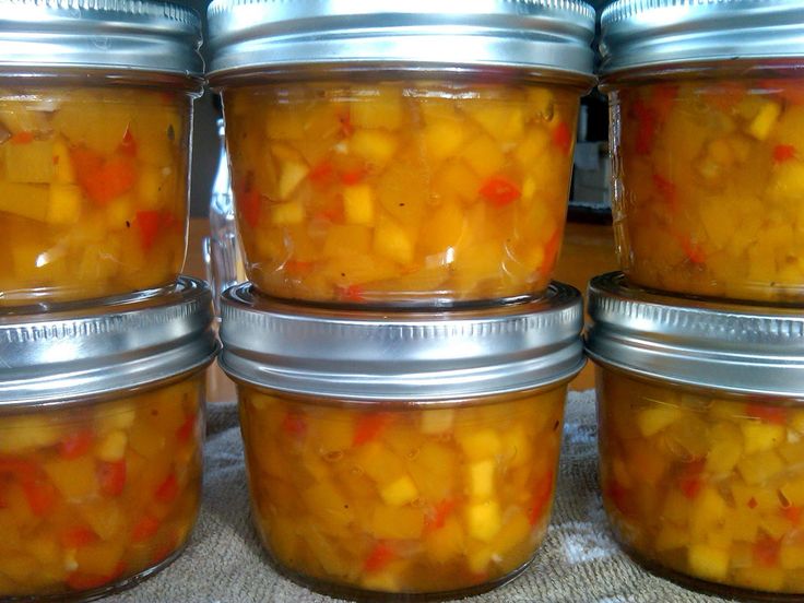 several jars filled with food sitting on top of a table