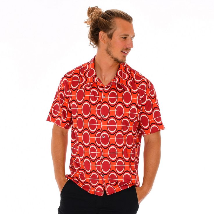 The DZ Men's Short Sleeve Slim Fit Button Up Shirt is made with butter jersey for a soft comfortable fit. The cut was fashioned from a curated 1970s shirt with an eccentric butterfly collar that can be worn open or closed. The Dorothy Zudora Lava Luau Print incorporates elements of geometric, space age and op art influences during the Mod fashion movement. All of our signature prints were designed by Dorothy Zudora and printed in the USA. This short sleeve button down shirt is crafted by extreme Retro Short Sleeve Camp Shirt With Relaxed Fit, Retro Camp Shirt With Relaxed Fit And Short Sleeves, Retro Short Sleeve Camp Shirt For Spring, Retro Short Sleeve Shirt With Button Closure For Summer, Retro Summer Short Sleeve Shirt With Button Closure, Summer Retro Short Sleeve Shirt With Button Closure, Retro Shirt With Johnny Collar And Relaxed Fit, Retro Spring Camp Shirt With Relaxed Fit, Retro Camp Collar Shirt For Spring