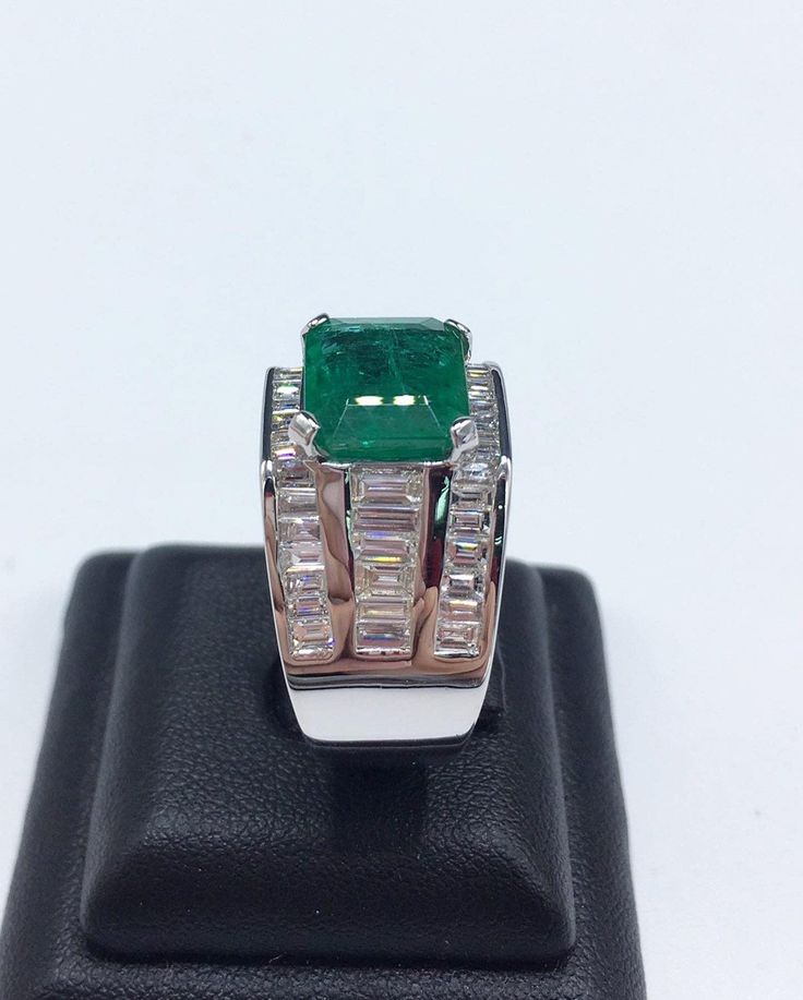 BRAND-NEW!! ONE OF A KIND, HANDCRAFTED RING. EXQUISITE AND FINE CRAFTSMANSHIP! HANDMADE TO LAST FOR AN ETERNITY!! HEIRLOOM PIECE!! PRECIOUS JEWELRY TO BE PASSED ON! PERFECT DRESS RING FOR A GENTLEMAN! 7.02 total carat weight, Certified, Natural emerald ring. This ring offers an important statement of who you are with a 4.76 carats, VIVID GREEN, transparent, ZAMBIAN EMERALD. Accentuating the EMERALD are the 48 SUBSTANTIAL F/VS, sparkling natural diamonds! Set in one of a kind, handmade 18K Solid Modern Emerald Signet Ring For Formal Occasions, Luxury Rectangular Emerald Ring In White Gold, Luxury Hallmarked Emerald Ring For Formal Occasions, Classic Gia Certified Emerald Ring For Formal Occasions, Formal Rectangular Emerald Ring With Polished Finish, Classic Emerald Signet Ring For Formal Occasions, Classic Emerald Signet Ring For Formal Events, Timeless Emerald Signet Ring For Formal Occasions, Formal Classic Gia Certified Emerald Ring