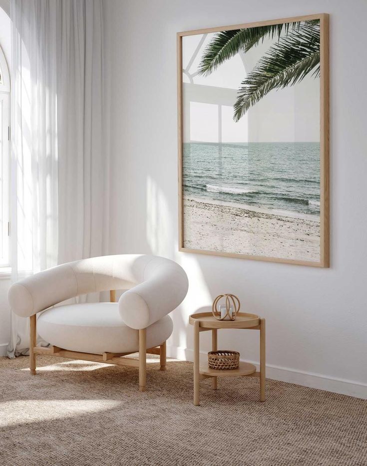 a white chair sitting in front of a window on top of a carpeted floor