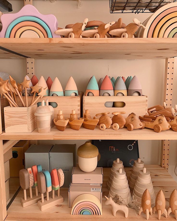 the shelves are filled with wooden toys