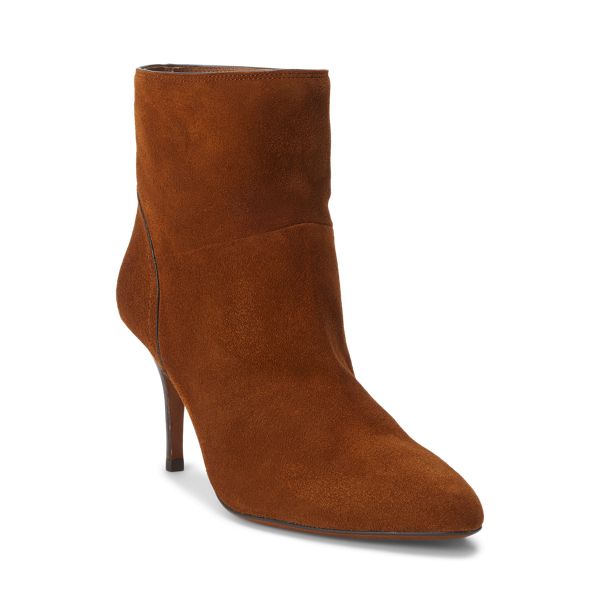 Expertly crafted in Spain with Italian sueded calfskin this versatile bootie is designed with a slender heel and slightly pointed toe. Classic Fall Boots With 4-inch Heel, Suede Ankle Boots With 4-inch Heel, Elegant Suede Heeled Boots With 4-inch Heel, Chic Suede Heeled Boots With 4-inch Heel, Chic Pointed Toe Heeled Boots With Suede Lining, Chic Almond Toe Boots With Suede Lining, Chic 4-inch Heel Suede Boots, Chic 4-inch Heeled Suede Boots, Fall Suede Boots With 4-inch Heel