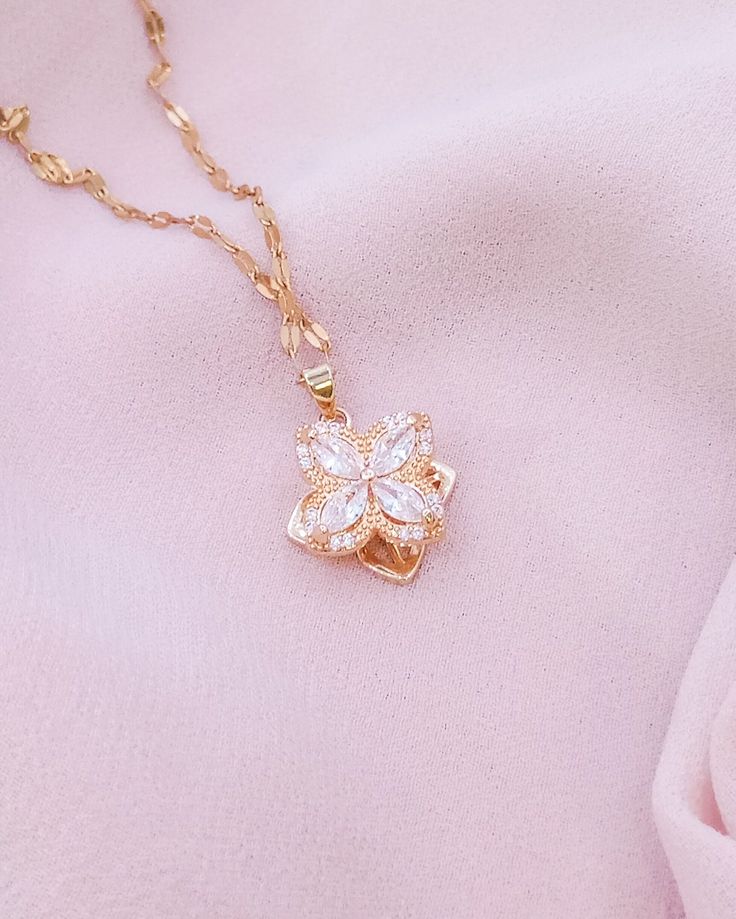 Embrace the grace of spring with our Blossoming Charm Necklace, featuring a delicate crystal flower pendant that sparkles with every turn. Suspended from a dainty gold chain, this necklace is a versatile piece that brings a touch of nature's beauty to your ensemble. It's perfect for layering or wearing solo as a subtle, yet enchanting statement. Need help? Want to purchase a bulk order? Get in touch! ~ Email: contact.aurumgrace@gmail.com ~ Instagram: @AurumGrace All images are copyrighted by Aur Feminine Necklace With Flower Pendant For Her, Feminine Necklace With Flower Pendant As Gift For Her, Feminine Flower Pendant Necklace Gift For Her, Feminine Flower Pendant Necklace As Gift For Her, Elegant Spring Jewelry With Adjustable Chain, Feminine Spring Jewelry Gift, Elegant Mother's Day Pendant Crystal Necklace, Feminine Necklace With Flower Charm, Delicate Pendant Crystal Necklace With Clavicle Chain