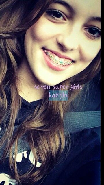 a smiling girl with braces on her teeth