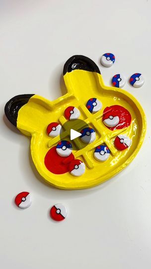 a yellow toy with red, white and blue designs on it