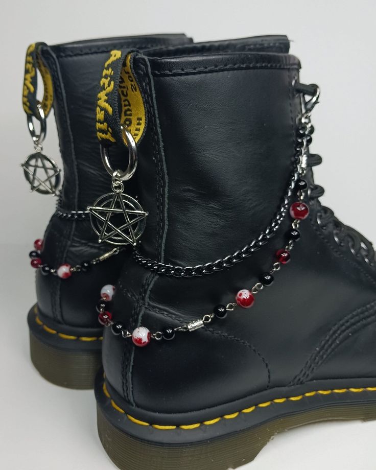 Boot chains with Onyx, Garnet and red splatter beads. Black chain. Choose full chain or half chain. Choose silvertone or black pentagram charms. If you have any questions, message me. Thank you! Boot Accessories Jewelry, Black Rock Style Jewelry For Streetwear, Rock Style Black Jewelry For Streetwear, Black Rock Style Jewelry For Halloween, Handmade Black Jewelry For Concert, Handmade Black Jewelry For Concerts, Handmade Black Jewelry For Streetwear, Black Handmade Jewelry For Streetwear, Alternative Black Chain Jewelry