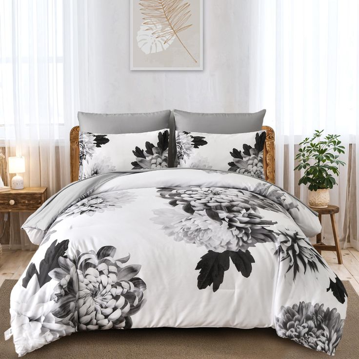 black and white floral comforter set in a bedroom