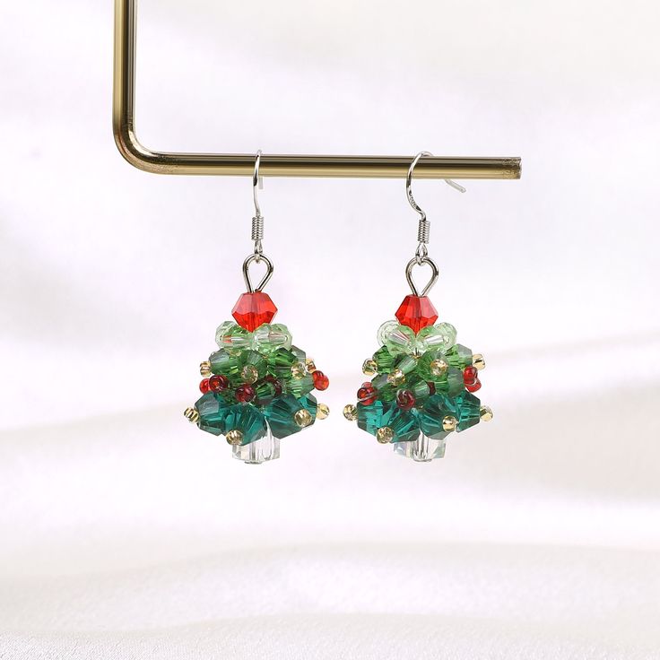 Crystal Christmas Tree Earrings for Women | 925 Sterling Silver Handmade Christmas tree Earrings | Christmas Jewelry | Christmas Party Gift 🎄Introducing our exquisite Crystal Christmas Tree Earrings for Women, a stunning piece of handmade Christmas jewelry that will captivate and accentuate your festive style. These earrings are meticulously crafted using high-quality crystal to create intricately designed Christmas trees, each adorned with sparkling crystals. The unique combination of elegance Crystal Christmas Tree, Crystal Christmas, Christmas Party Gift, Thoughtful Christmas Gifts, Handmade Christmas Tree, Christmas Gathering, Tree Earrings, Christmas Tree Earrings, Beautiful Christmas Trees