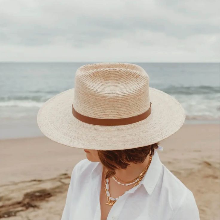 a little western and a little unexpected in the best ways - meet the moonlight straw rancher, a statement hat that's not just for country concerts and riding horses. the moonlight is handcrafted with fine tripilla palm straw that's been sustainably harvested by artisans in puebla, mexico. wear this straw hat for a long day outdoors, offering UPF 50+ sun protection and a large, structured, 4" brim to help shield your face from harmful rays. the cattleman style crown and toasted caramel straw colo Statement Hat, Country Concerts, Skin Care Gifts, Handmade Hat, Crossbody Tote, Hat Band, Horse Riding, Straw Hat, Upf 50