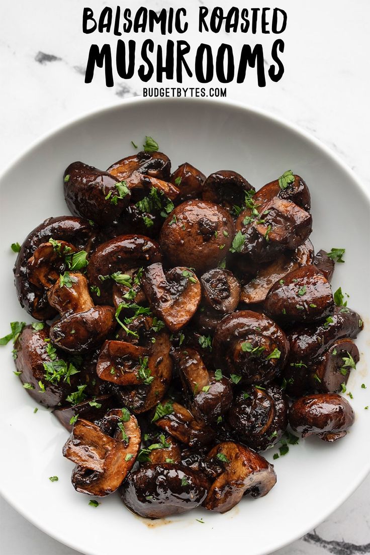 mushrooms with parsley in a white bowl on a marble countertop and text overlay reads balsamic roasted mushrooms