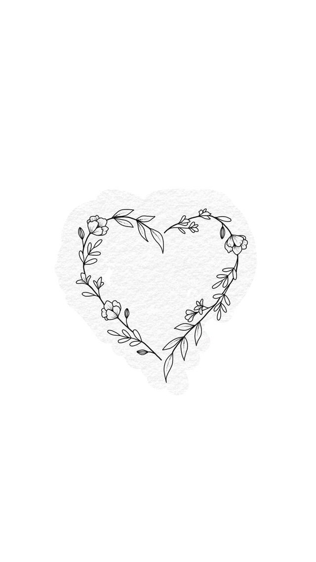 a heart shaped frame with flowers and leaves drawn on the side, in black ink