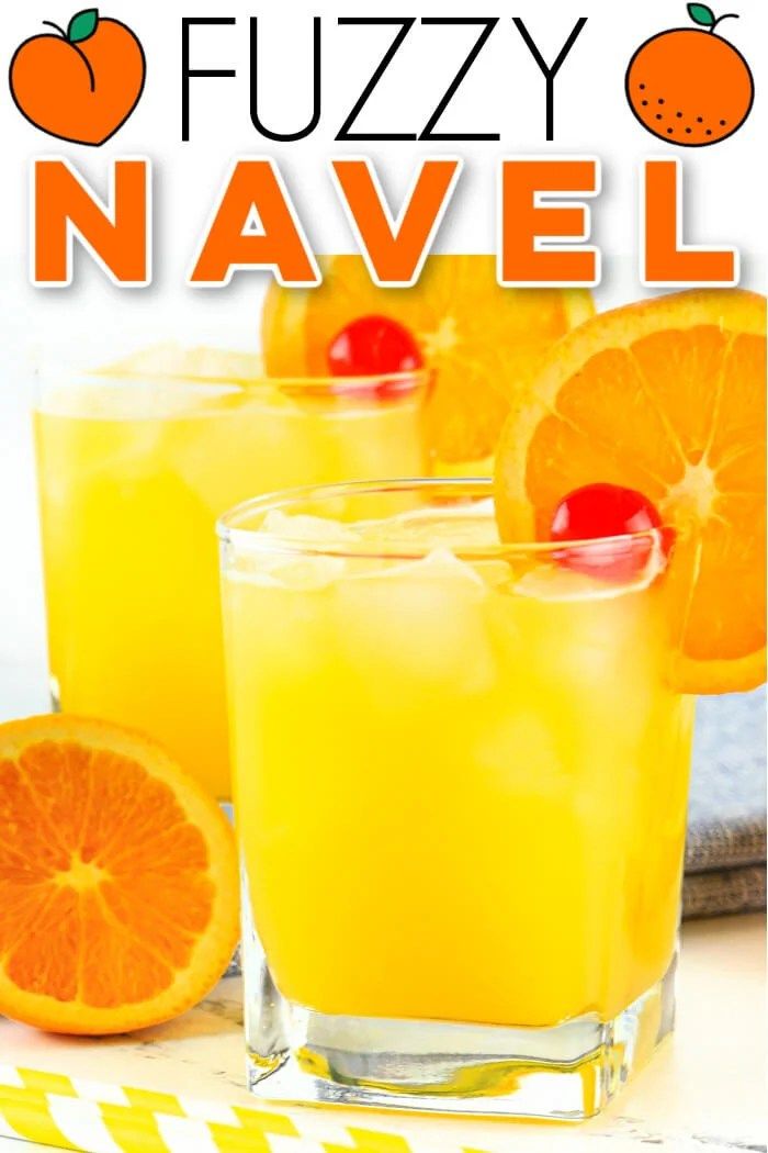 two glasses filled with orange juice and garnished with an orange slice on the side