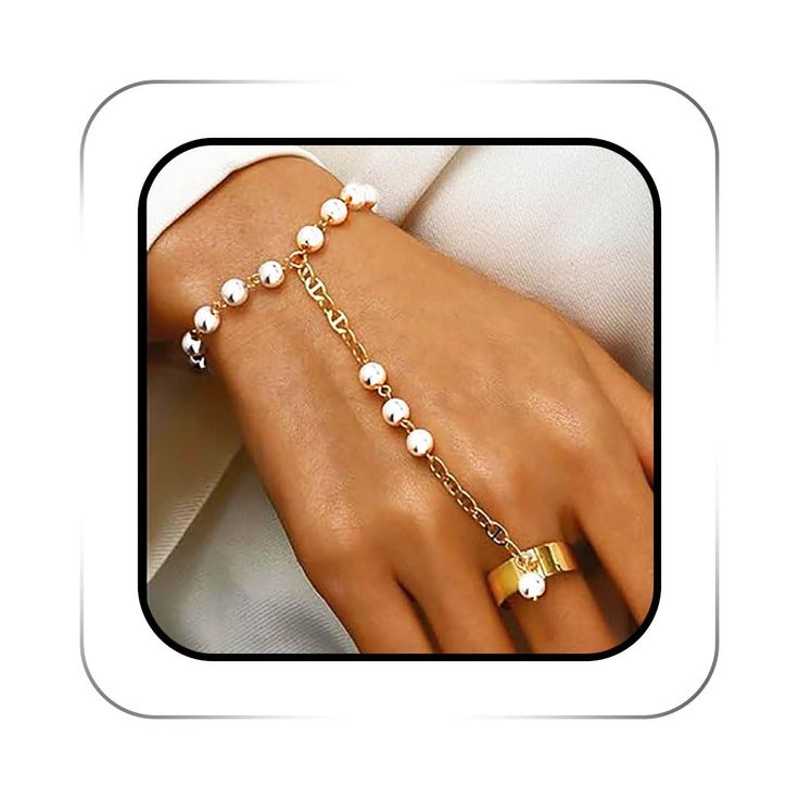 PRICES MAY VARY. Pearl Slave bracelet is made of alloy,which are not easy to fade and deform,elegant and beautiful. Gold Bracelet jewelry from the wrist to ring is 11cm/4.3'' length,the perimeter of ring is 6cm/2.43'',wrist measures 20cm/7.87" in length ,comes with a 5cm/1.96" extender chain so it is adjustable around the wrist area. Finger Ring Bracelets design with pearl decorated adds aesthetic feeling for your hand, and makes them attractive and exquisite. Bracelet with ring is available for Pearl Finger Ring, Hand Harness, Gold Finger Rings, Hand Chain Bracelet, Bracelets Design, Bracelets Gold, Bracelet Fashion, Fits Women, Hand Chain