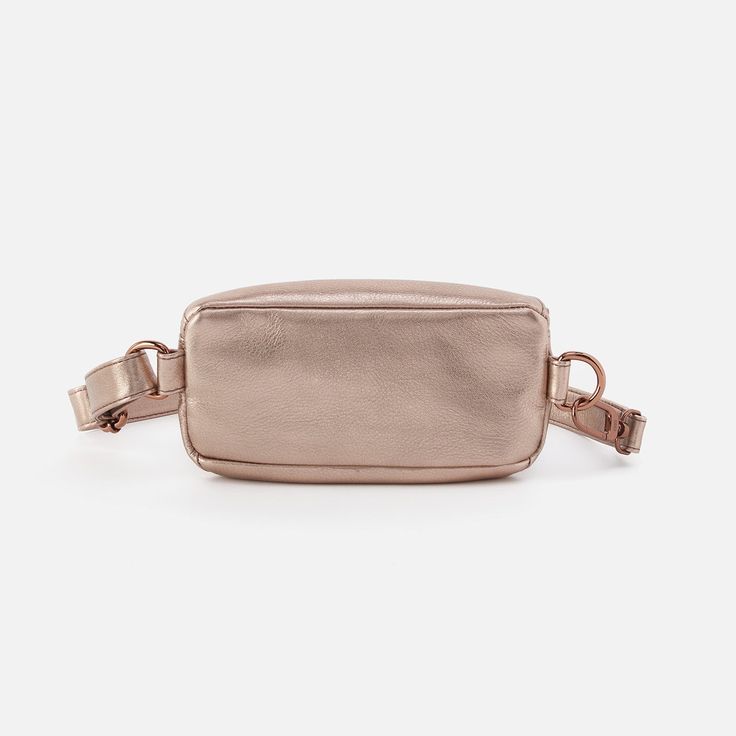 Our Fern Collection takes on a whole new dimension with the Fern Belt Bag. With the tassel zippers you know and love, this belt bag can also be worn as a crossbody so you can be hands-free to reach for more. New Dimension, Fly London, Metallic Pink, Metallic Leather, Brass Hardware, Pink Gold, Hands Free, Belt Bag, Accessories Shop