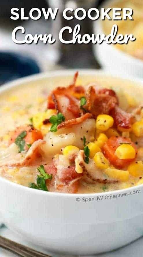 slow cooker corn chowder in a white bowl with bacon and parsley on top