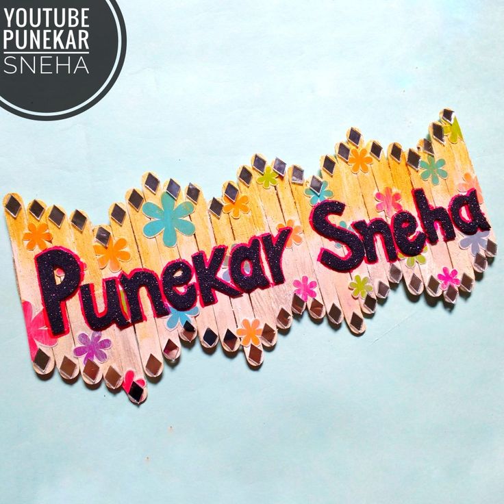 a wooden stick with the word punekar shred written in pink and yellow