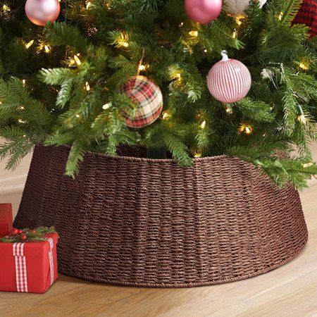 a christmas tree with ornaments in a basket