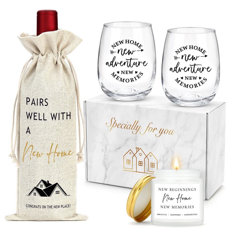 two wine glasses and a candle in front of a gift bag with the words pairs well with a new home on it