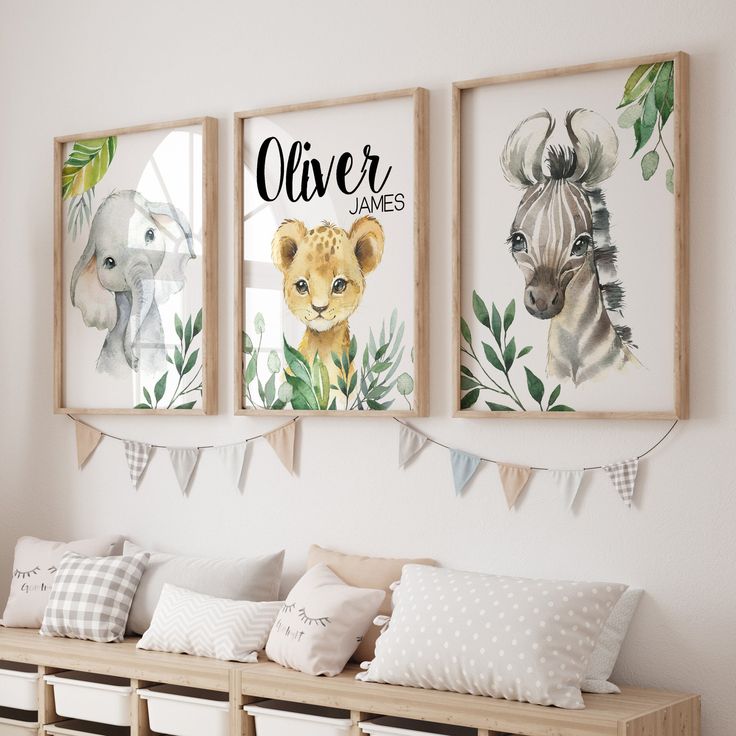 three framed pictures hang on the wall above a wooden bench with pillows and pillow cases