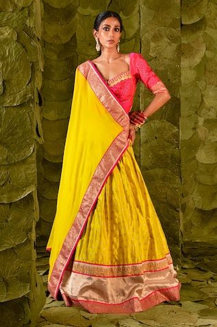 Passionfruit yellow lehenga with gold zari beaten hand embroidery. Paired with a pink embroidered blouse and fan pleat trimmed embroidered dupatta. - Aza Fashions Yellow Cutdana Sets For Reception, Festive Yellow Raw Silk Pre-draped Saree, Yellow Cutdana Sharara For Reception, Yellow Chanderi Sets For Reception, Yellow Tissue Silk Pre-draped Saree For Navratri, Fitted Yellow Pre-draped Saree With Pallu, Yellow Chanderi Saree For Reception, Yellow Gota Work Sets For Reception, Designer Yellow Sets With Cutdana