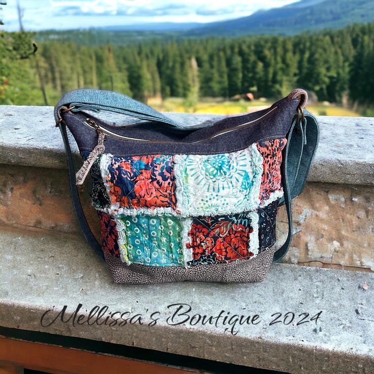 Introducing The Adeline, a handmade, one-of-a-kind convertible-style boho handbag that radiates charm and individuality. This exquisite bag features raggy style quilted patches on the front with upcycled denim for the backside with a zippered pocket and a slip pocket for convenience! Distressed grey cowhide leather accents, beautifully showcasing shades of blue & coral. The Adeline includes strapping that effortlessly converts from shoulder carry to backpack carry in seconds! Designed for comfortable and versatile wear. The leather bottom adds durability, while the gorgeous blue batik cotton interior fabric, enhances its bohemian flair. Inside, you'll find three slip pockets and one zippered pocket, providing ample space for your essentials. Measuring 14" x 11" x 5.5", this handbag offers Bohemian Canvas Shoulder Bag For Daily Use, Bohemian Canvas Hobo Bag Rectangular, Bohemian Style Canvas Shoulder Bag For Daily Use, Bohemian Canvas Rectangular Hobo Bag, Bohemian Canvas Hobo Bag Shaped As Tote, Bohemian Canvas Hobo Tote Bag, Bohemian Canvas Bags With Adjustable Strap, Bohemian Canvas Tote Hobo Bag, Bohemian Upcycled Multicolor Shoulder Bag