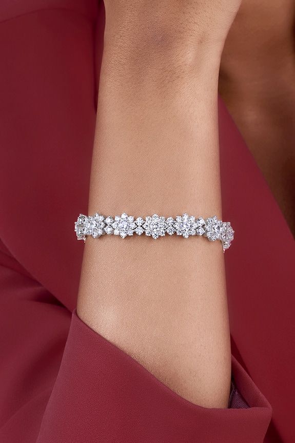 925 sterling silver bracelet embellished with white swarovski zirconia stones in floral pattern. - Aza Fashions Elegant Sparkling Diamond Bracelet, Elegant White Gold Sparkling Diamond Bracelet, White Bracelets With Sparkling Stones In Fine Jewelry Style, Fine Jewelry White Bracelets With Sparkling Stones, White Bracelets With Sparkling Stones Fine Jewelry, White Crystal Bracelets Fine Jewelry, Sterling Silver Bracelet With Sparkling Stones, Elegant Sparkling Sterling Silver Diamond Bracelet, Dazzling White Bracelets With Sparkling Stones