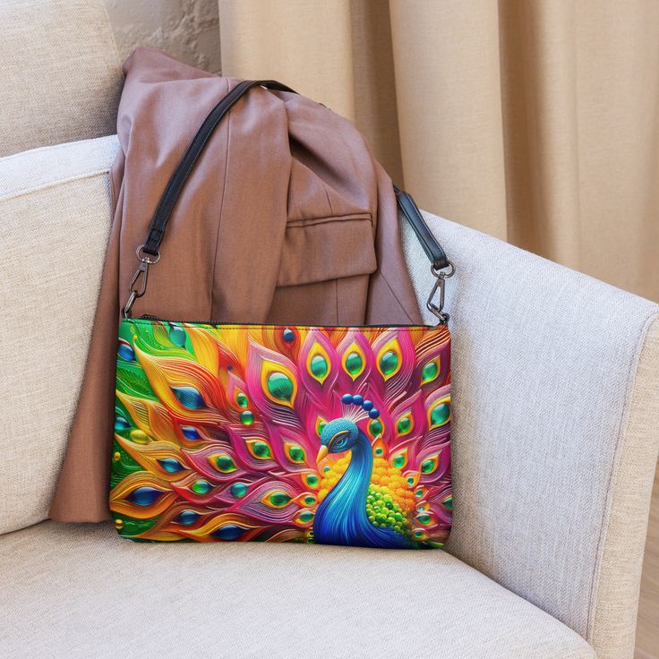 🦚Keep your style on point and your hands free with our Versatile Crossbody/Shoulder Bag Purse with a Unique & Colorful Peacock Design. It's made of premium faux leather and features dark gray hardware. Thanks to the zip-top closure and multiple inside pockets, you can keep your essentials secure and organized. Transform this crossbody bag with removable wrist and shoulder straps to style it for day-to-night looks. * Outer fabric: faux leather  * Lining: 100% polyester * 11″ × 8″ × 1.5″ (27.9 cm × 20.3 cm × 3.8 cm) * Dark gray hardware * Zip-top closure * Inside zip and slip pockets * Adjustable, removable wrist and shoulder straps * Strap drop length: 14″- 27″ Our Other Crossbody Bags: https://www.etsy.com/shop/ZazzFashion?section_id=45645921 Trendy Multicolor Phone Bag For Daily Use, Multicolor Clutch Mobile Phone Bag, Multicolor Clutch With Mobile Phone Bag, Trendy Multicolor Handheld Bag, Multicolor Pouch Shoulder Bag For Mobile Phone, Multicolor Large Capacity Pouch Shoulder Bag, Multicolor Handheld Shoulder Bag With Removable Pouch, Multicolor Mobile Phone Pouch Shoulder Bag, Multicolor Mobile Phone Pouch Bag