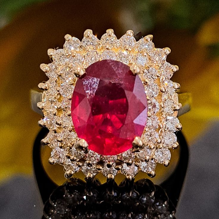 This Ruby is authentic as they are grown in a lab environment. 3.75 Carat Lab-created Ruby & Natural Diamonds 14k Solid Yellow Gold Ring Ring Material: 14k Solid Gold Approximate Weight: 5.8 Grams Band Width about 2.0 mm Gemstone: Lab-created Ruby Gemstone Color: Red Gemstone Clarity: Moderately Included Gemstone Shape: Oval Gemstone Dimensions are about: 9.70x7.90 mm Gemstone Carat Weight about: 2.80 Carat Gemstone Quantity: 1 Diamonds: Natural Round Shaped Diamonds Color: G Diamonds Clarity: S Gia Certified Oval Ruby Ring, Dazzling Oval Ruby Ring With Diamonds, Luxury Oval Diamond Ring With Lab-created Ruby, Oval Yellow Gold Halo Ring Gia Certified, Oval Ruby Ring With Diamond Center Stone, Oval Ruby Ring With Vvs Clarity Diamond, Oval Ruby Diamond Ring With Prong Setting, Oval Lab-created Ruby Fine Jewelry For Wedding, Oval Ruby Ring With Diamond