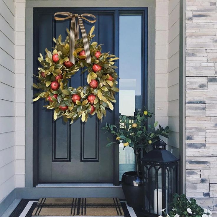 a wreath on the front door of a house