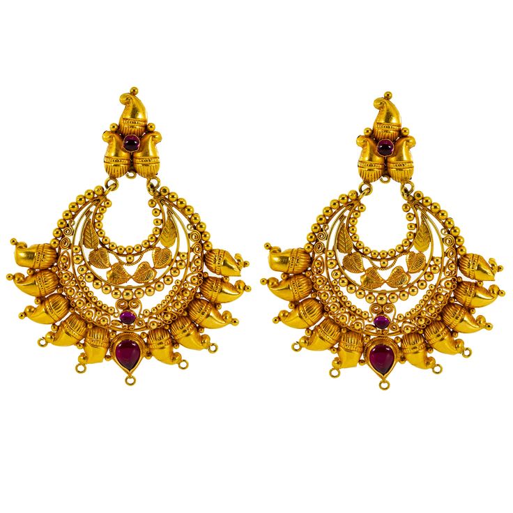 Discover the essence of luxury with this 22k yellow gold and ruby necklace and Chandbali earring set from Virani Jewelers. This divine jewelry set, a testament to traditional Indian jewelry, features artistic craftsmanship, rubies, and a radiant gold finish. Perfect for enhancing your ensemble with a touch of elegance, this one of a kind 22k yellow gold jewelry set offers a stylish appeal that resonates with those who appreciate the finer things in life. Ideal for adding a sophisticated touch to Bollywood Style 22k Gold Jewelry For Navratri, Traditional Ruby Jewelry With Intricate Design, 22k Gold Chandbali Jewelry For Puja, 22k Gold Chandbali For Puja, Traditional Yellow Gold Chandbalis With Intricate Design, Traditional Yellow Gold Chandbalis For Festive Occasions, Temple Jewelry Yellow Gold Chandbalis, 22k Gold Chandbali Jewelry For Diwali, Yellow Gold Chandbalis With Intricate Design For Festivals