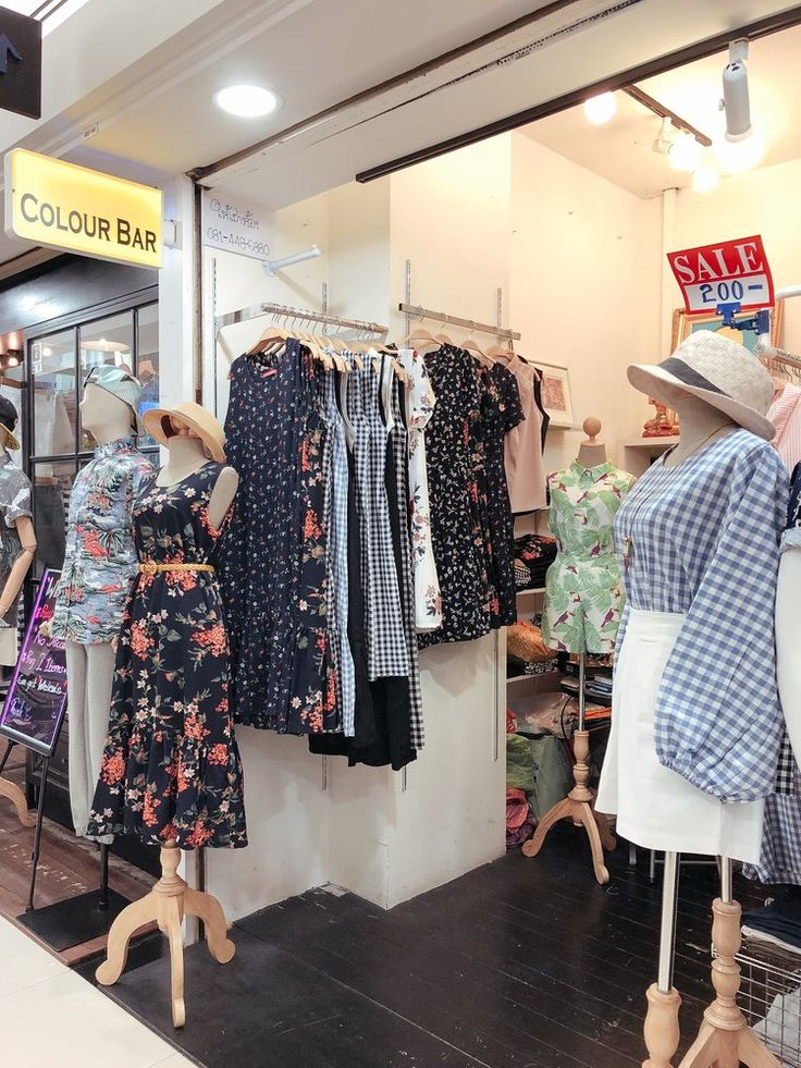 clothes are on display in a clothing store