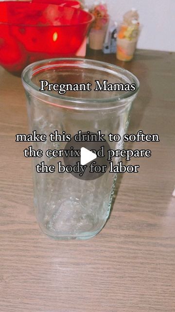 a glass cup sitting on top of a wooden table